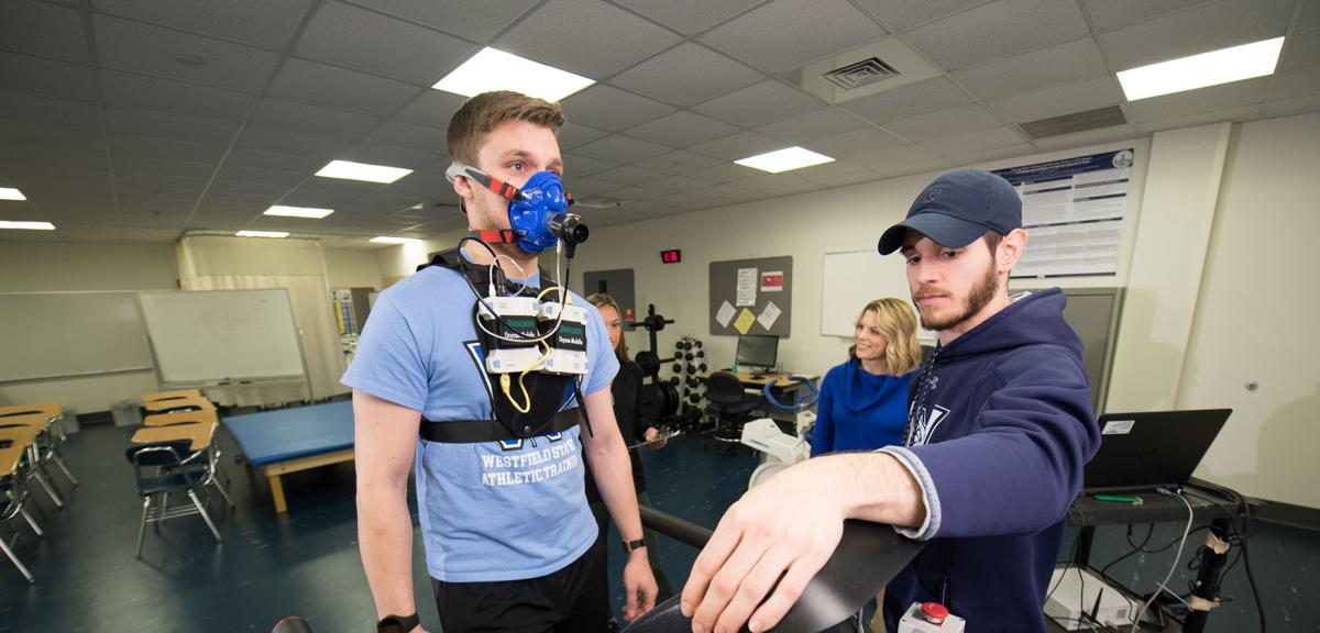 Students practice using cutting-edge stress test equipment in a sports medicine lab.