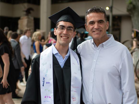WIPSE student and family member smiling at commencement.