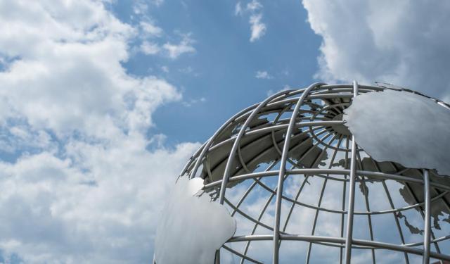 Campus Globe against cloudy blue sky