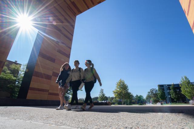 Students Walking Under University Hall